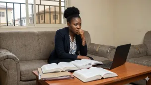 A worried black woman at home 